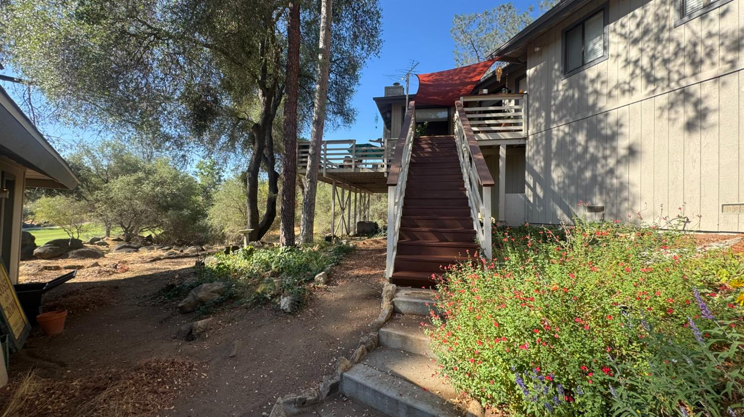 31160 Revis Road Coarsegold, CA 93614 - Photo 3 of 15 a backyard of a house with lots of green space
