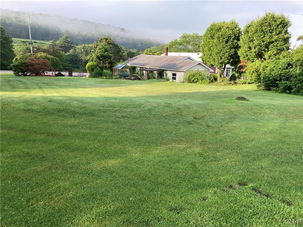 4915 Interchange Road Lehighton, PA 18235 - Photo 2 of 2 a view of a big yard with an outdoor space and seating area