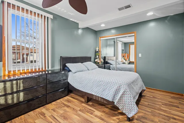 a bed room with a bed and a window