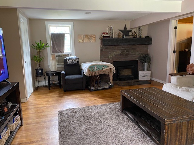 50 Liberty Church Road Exeter, RI 02822 - Photo 7 of 25 Living room fireplace with woodstove insert