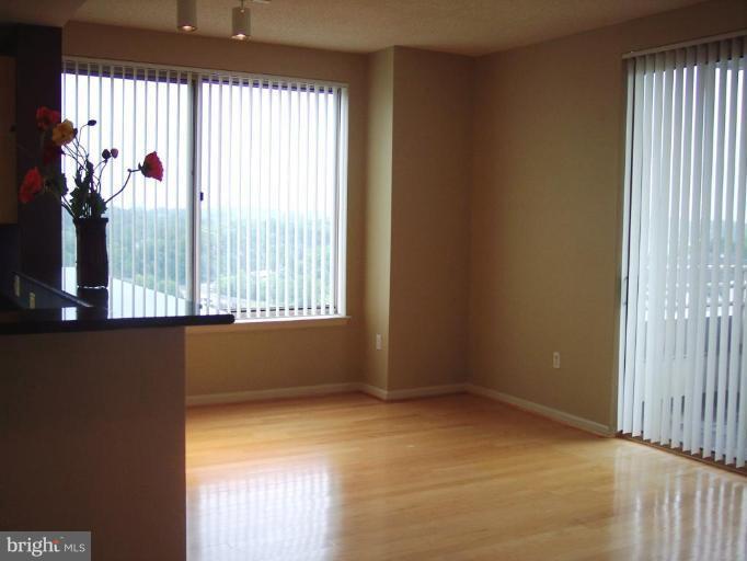 2726 Gallows Road, Unit 1416 Vienna, VA 22180 - Photo 2 of 22 a view of an empty room with a window