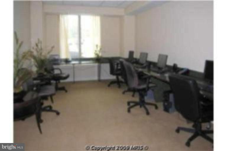 2726 Gallows Road, Unit 1416 Vienna, VA 22180 - Photo 13 of 22 a view of a workspace with furniture and a window