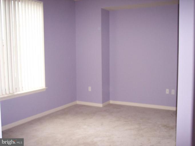 2726 Gallows Road, Unit 1416 Vienna, VA 22180 - Photo 9 of 22 a view of an empty room and window