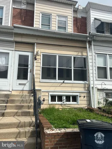 an aerial view of residential houses with outdoor space and street view