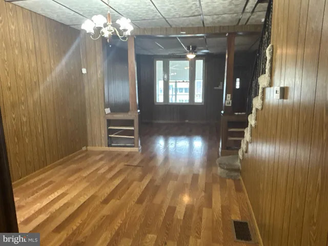 a view of gallery with wooden floor