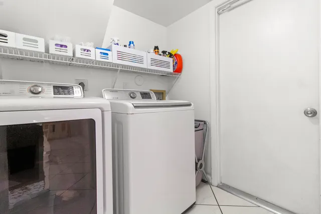 a view of a hallway with wooden floor and entryway