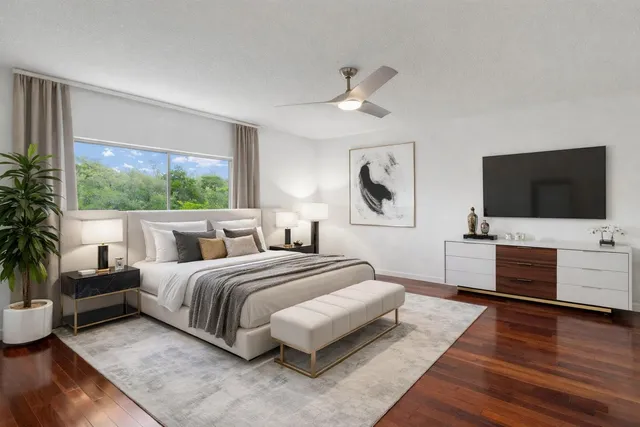 a view of a livingroom with furniture and wooden floor