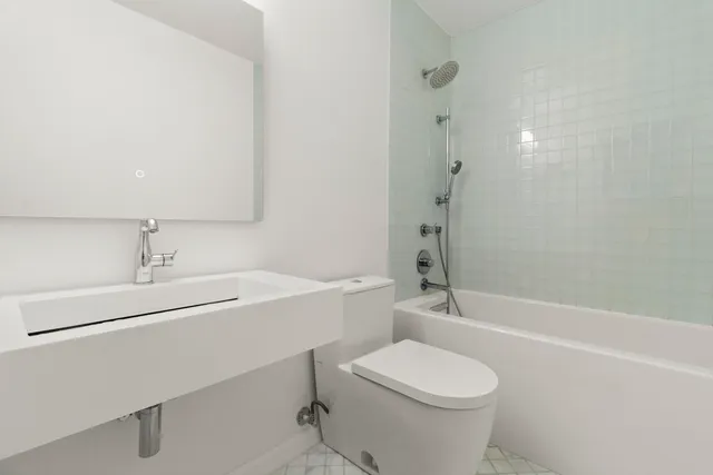 a room with a bed and a window