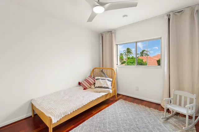 a bedroom with a bed and a chair