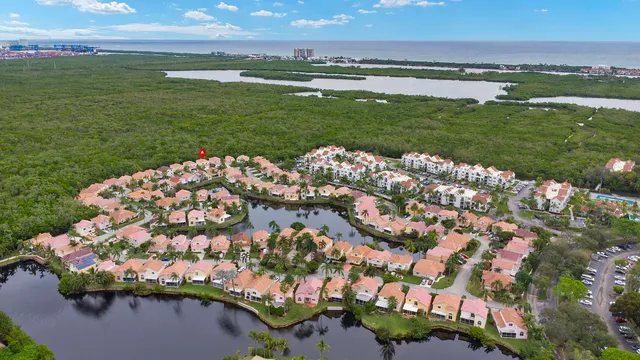 an aerial view of a house with a yard and a garden