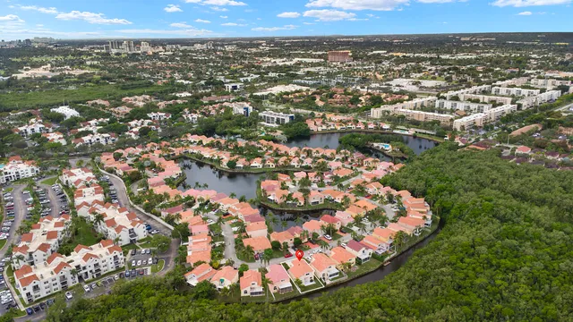 an aerial view of residential houses with outdoor space