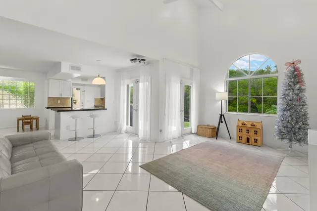 a living room with furniture and windows