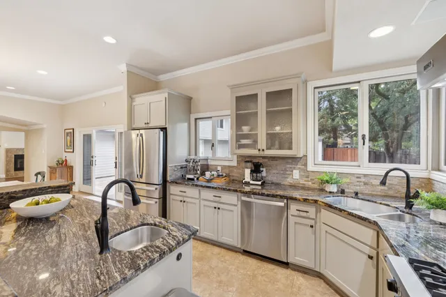 a view of a livingroom with furniture and a chandelier
