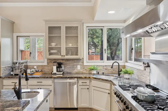 a dining room with furniture window and wooden floor