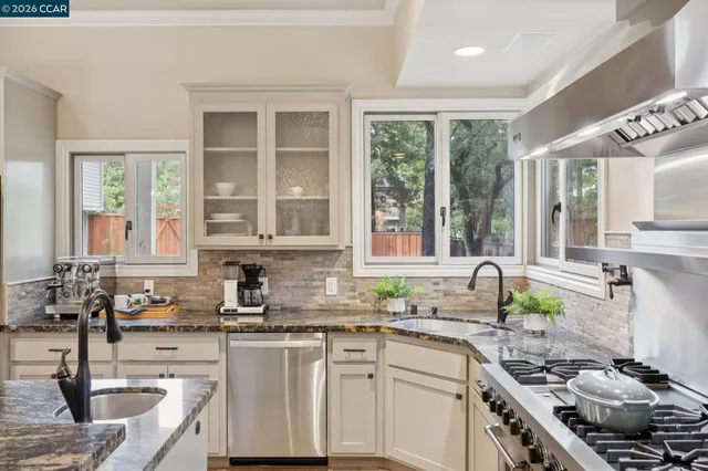 a dining room with furniture window and wooden floor