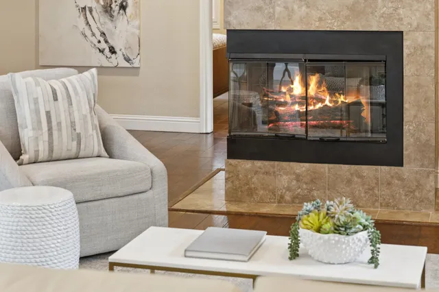 a living room with furniture and a large window