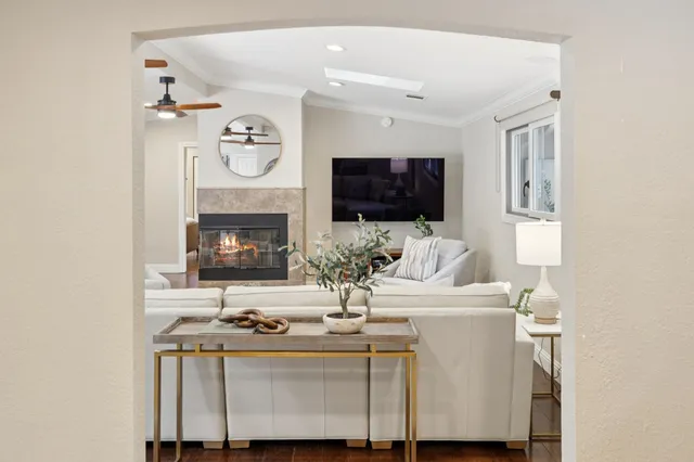 a bedroom with a large bed and a large window