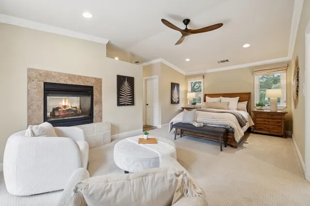 a large white kitchen with cabinets