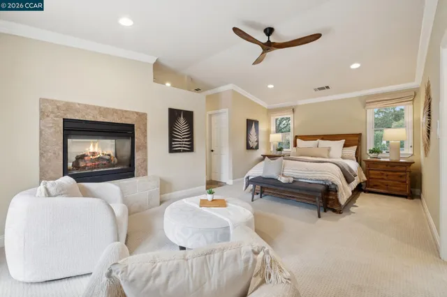 a living room with furniture and a painting