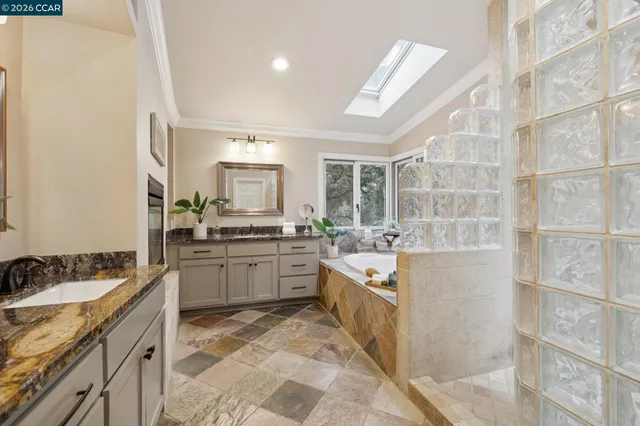 a bathroom with a tub and shower