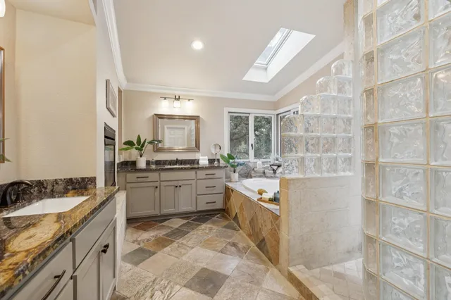 a bathroom with a tub and shower