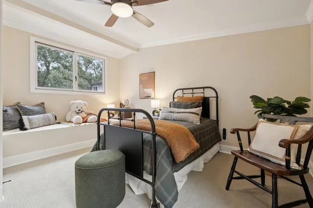 a bedroom with a bed and a dresser