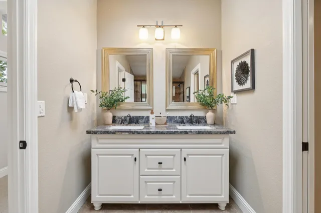a utility room with wooden floor washer and dryer