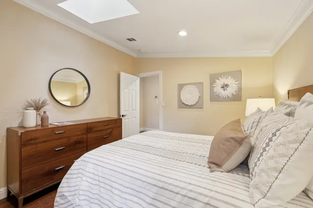 a view of a patio with couches and a table and chairs with garden view