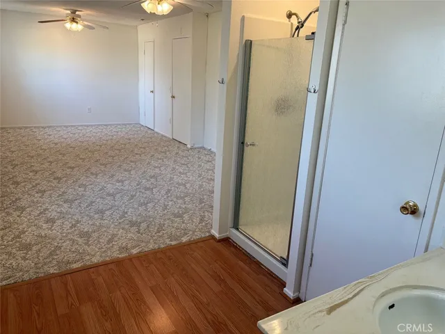 a bathroom with a tub and shower