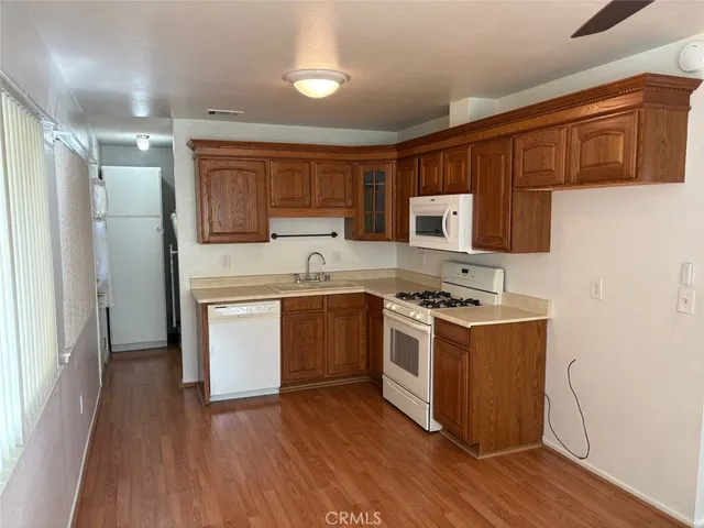 a kitchen with a sink cabinets and stainless steel appliances
