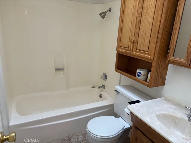 a bathroom with a sink a toilet and bathtub