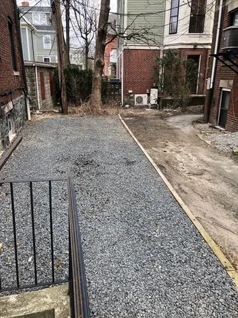 a bedroom with a bed and a mirror