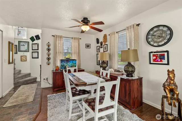 a view of a livingroom with furniture and a large window