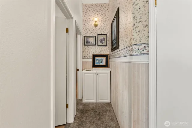 a view of a hallway with windows