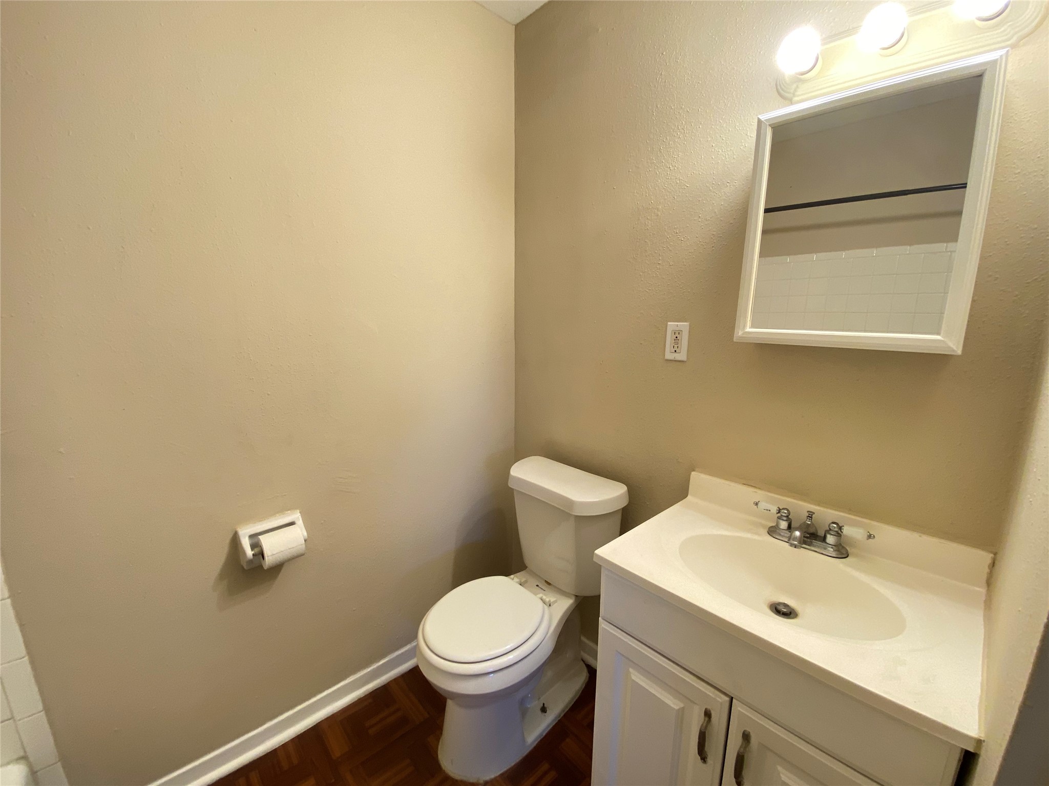 3024 Elgin Street, Unit 8 Houston, TX 77004 - Photo 8 of 11 a bathroom with a sink mirror and toilet