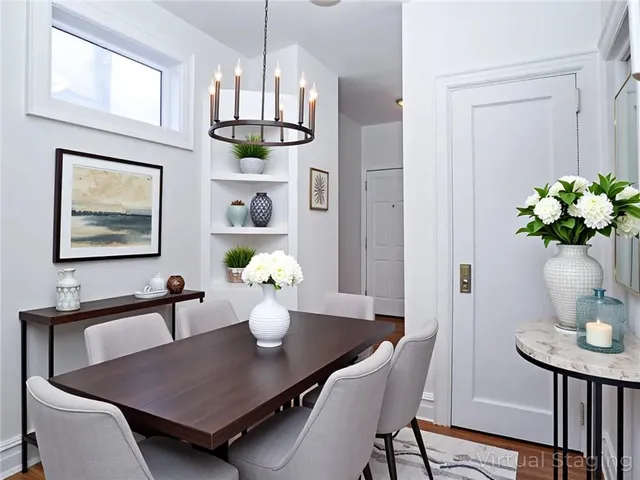 a bedroom with bed and a large window