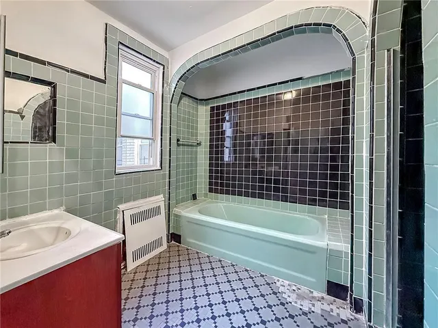 a room with water heater and refrigerator