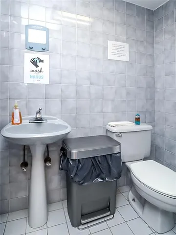 a view of a wooden door with a sign on the wall