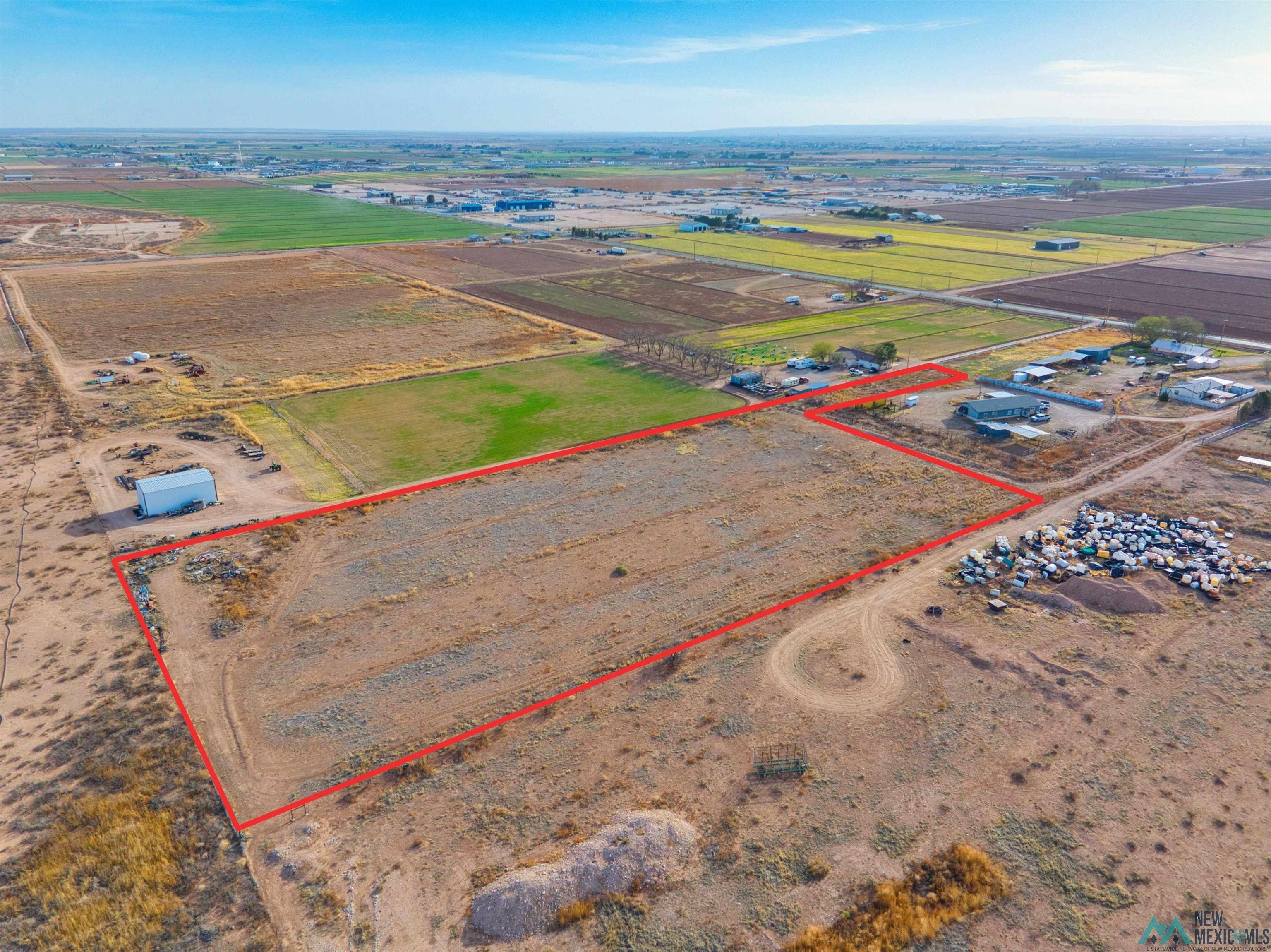 3328 Grandi Rural Road Carlsbad, NM 88220 - Photo 3 of 11 Aerial view of sparsely populated area with property parcel outlined and farmland