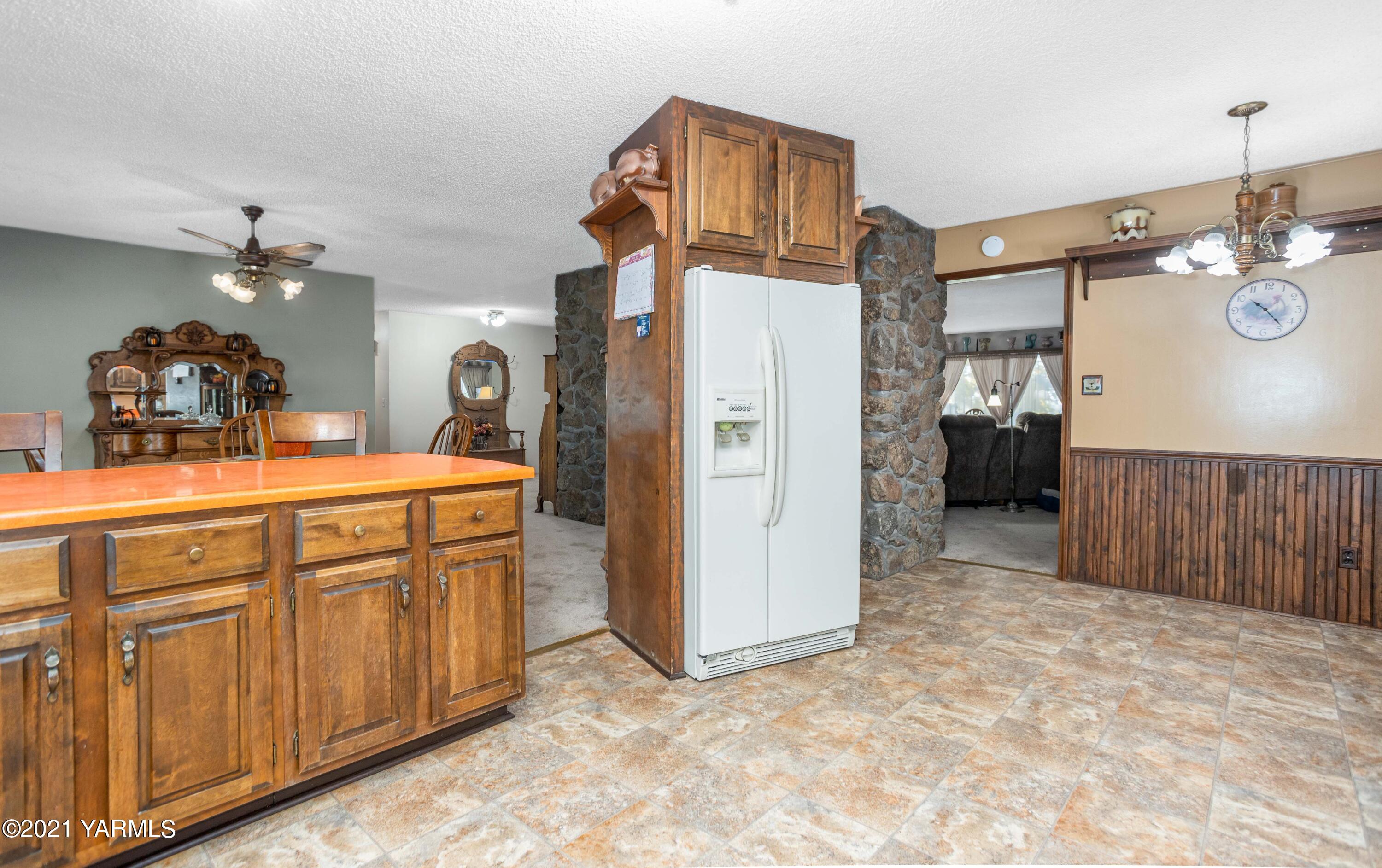 800 Blaine Road Granger, WA 98932 - Photo 10 of 43 a view of a kitchen sink and refrigerator