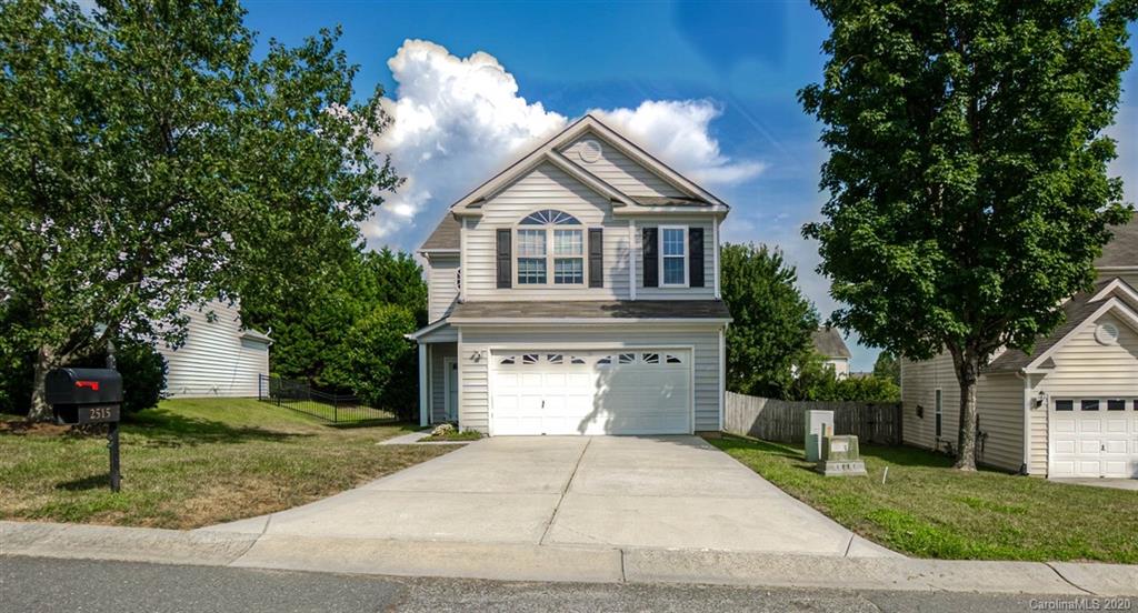 2515 Fossil Stone Lane Fort Mill, SC 29708 - Photo 1 of 37 a front view of a house with a yard and garage