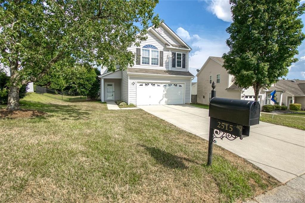 2515 Fossil Stone Lane Fort Mill, SC 29708 - Photo 2 of 37 a front view of a house with a yard
