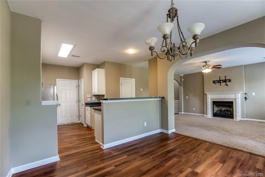 2515 Fossil Stone Lane Fort Mill, SC 29708 - Photo 13 of 37 a view of a kitchen with a sink wooden floor and a kitchen