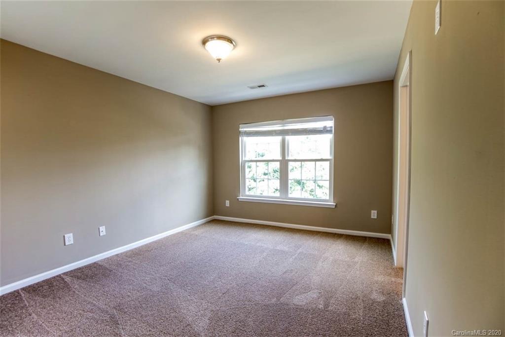 2515 Fossil Stone Lane Fort Mill, SC 29708 - Photo 16 of 37 a view of an empty room with a window