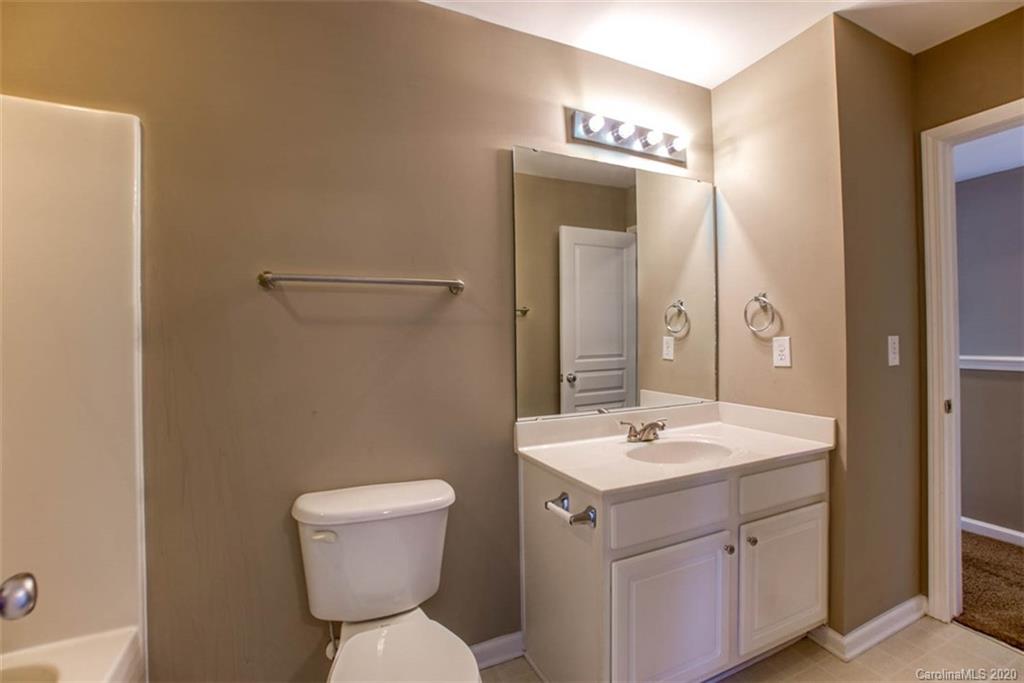 2515 Fossil Stone Lane Fort Mill, SC 29708 - Photo 19 of 37 a bathroom with a sink and a mirror