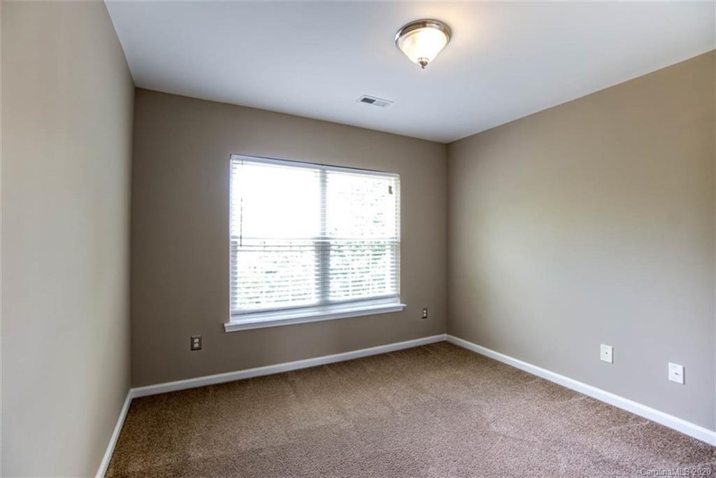 2515 Fossil Stone Lane Fort Mill, SC 29708 - Photo 21 of 37 an empty room with a window