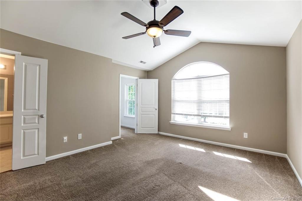 2515 Fossil Stone Lane Fort Mill, SC 29708 - Photo 26 of 37 a view of a livingroom with a ceiling fan and window