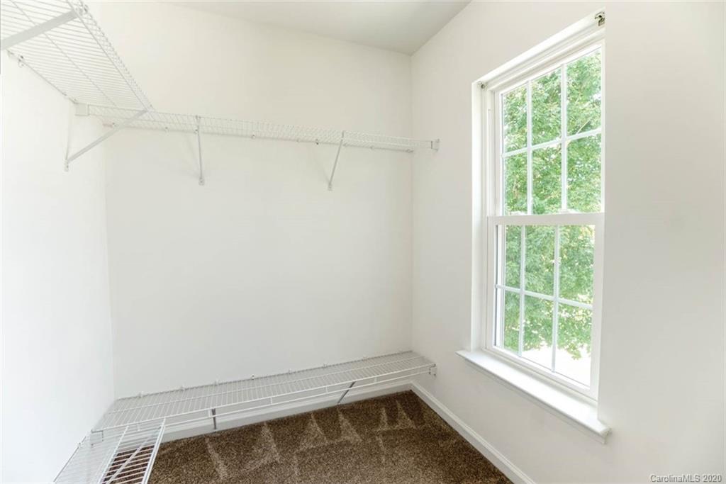 2515 Fossil Stone Lane Fort Mill, SC 29708 - Photo 28 of 37 a view of a room with rack on the wall and a window