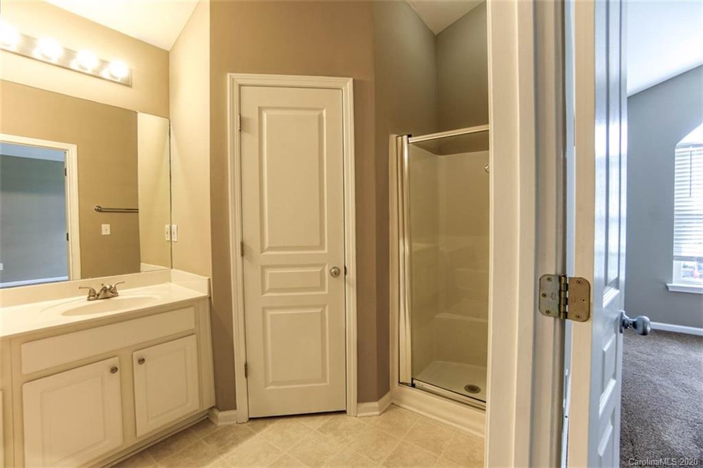 2515 Fossil Stone Lane Fort Mill, SC 29708 - Photo 31 of 37 a bathroom with a granite countertop sink mirror and a