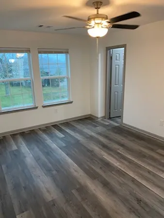 a view of an empty room with a window
